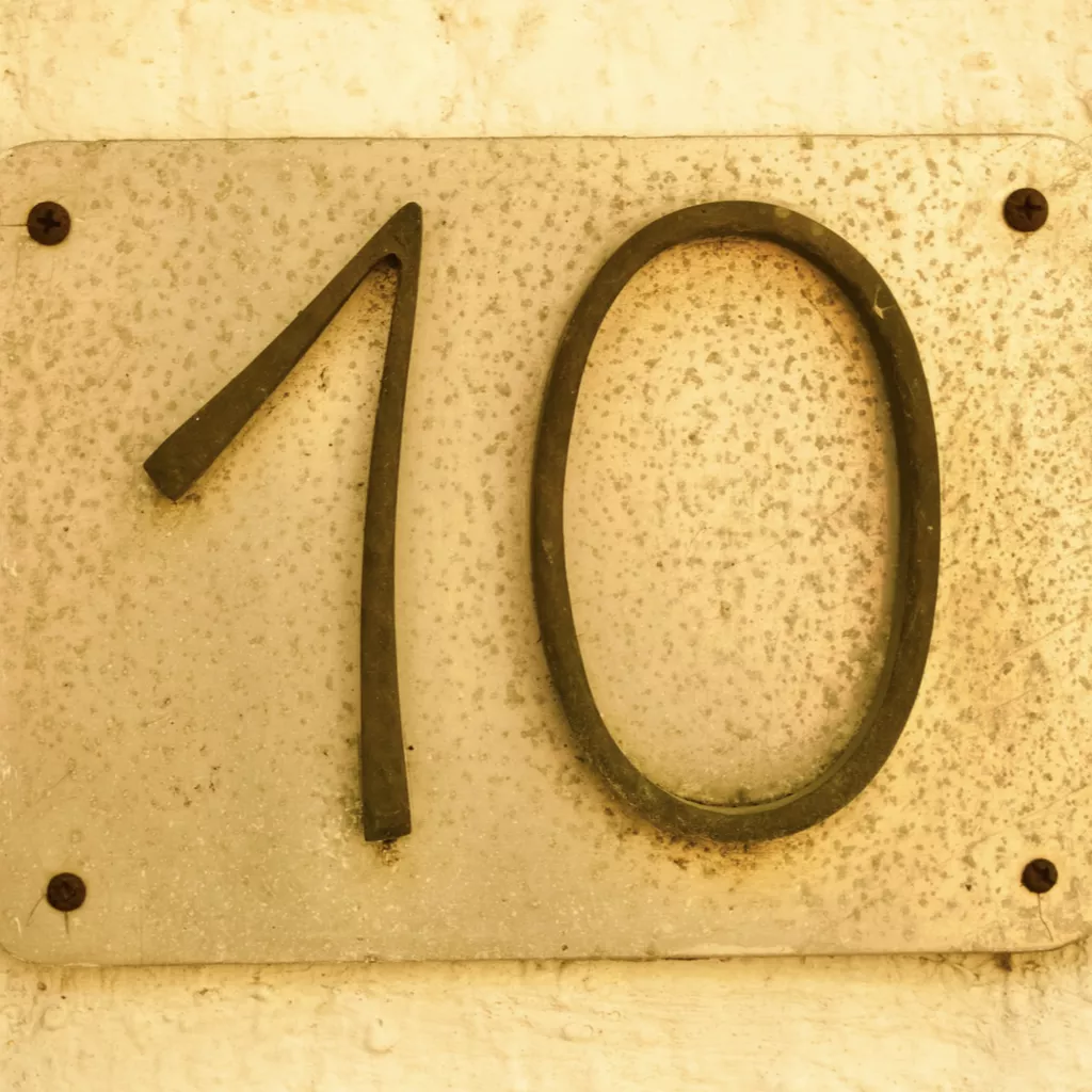 The number ten is written on a sign.