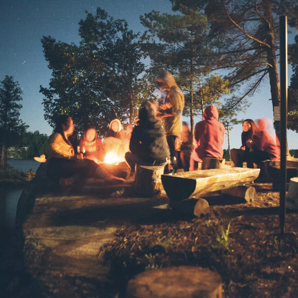 Example family tradition of spending time together by a fire.