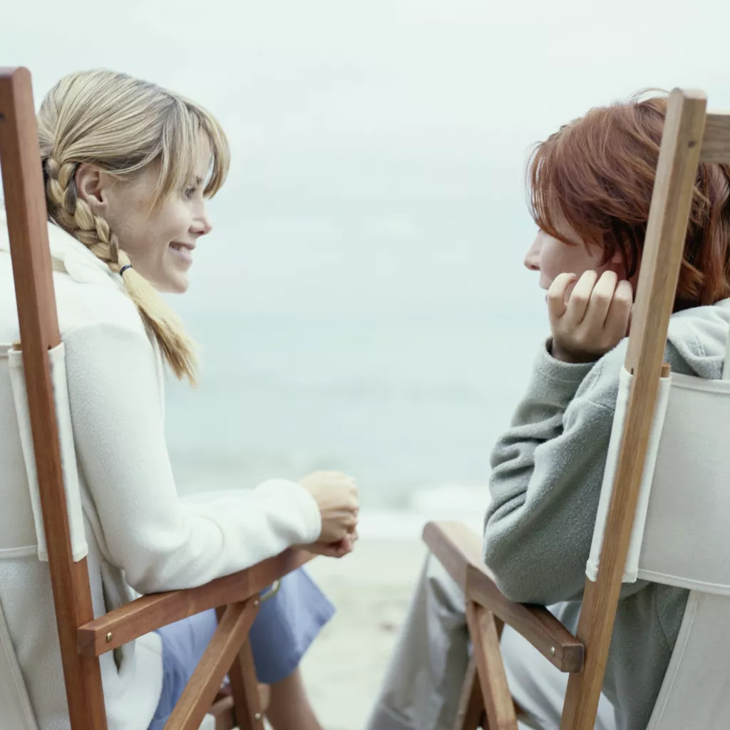 Two ladies sat talking.