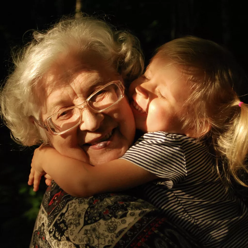 A happy grandmother with her loving granddaughter.