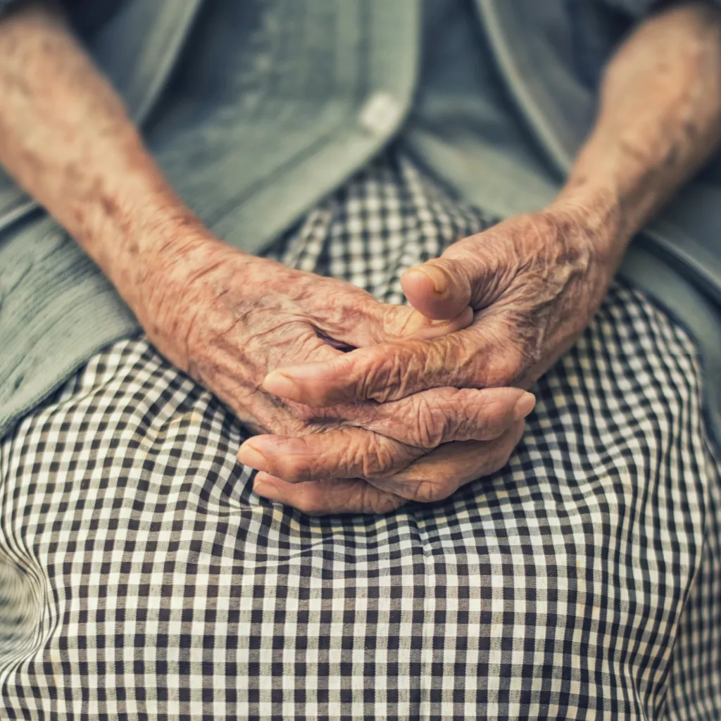 A pair of elderly hands.