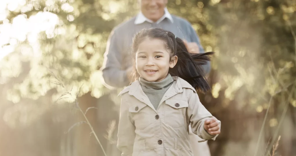 A happy girl followed by her Grandfather. What lasting family legacy will she inherit?