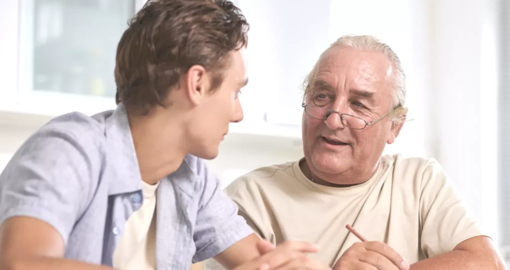 A grandfather sharing wisdom and experiences with his grandson.