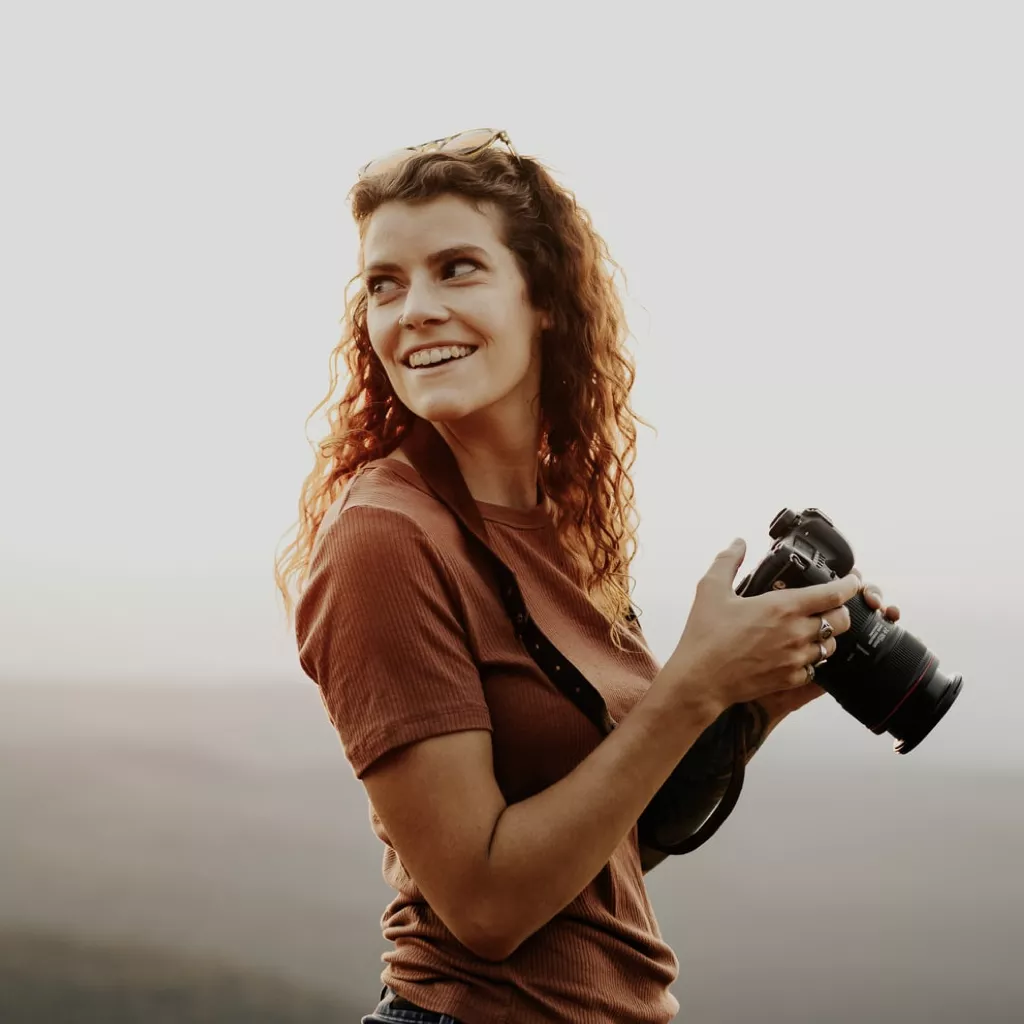 A happy lady enjoying photography.