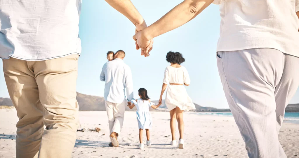 A family connected by hands.