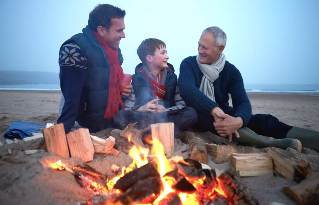 A family storytelling around a fire, which is less and less common in our busy modern lives.