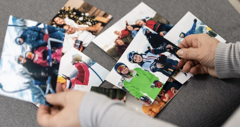 A collection of photos scattered on a sofa that could be used in digital storytelling.