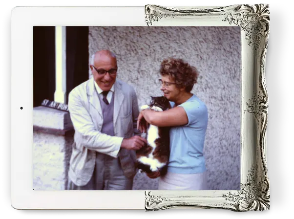 A family heritage photo, or senior family members enjoying a moment with their cat