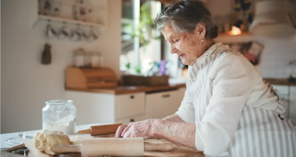 A grandmother baking for her family.